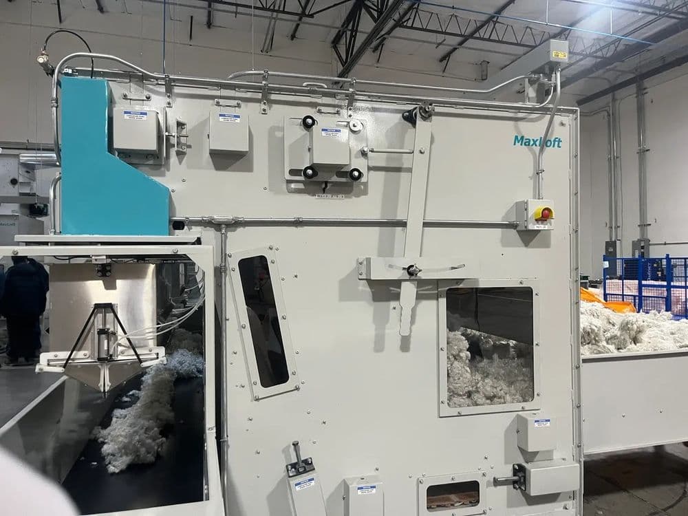 Maxiloft cotton processing machine in a modern industrial facility.